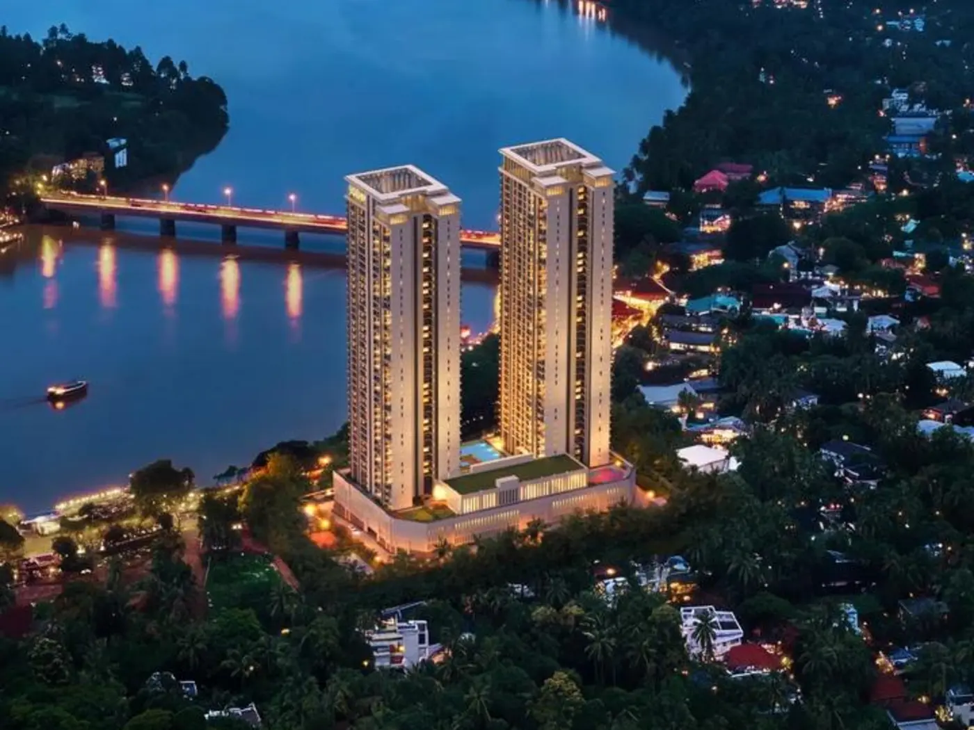 Aerial twilight view of the twin towers beside the river