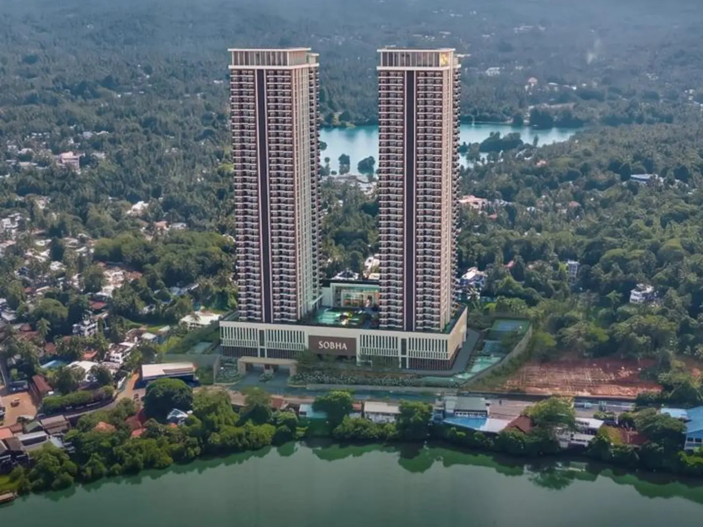 Aerial daytime view of the twin towers beside the river