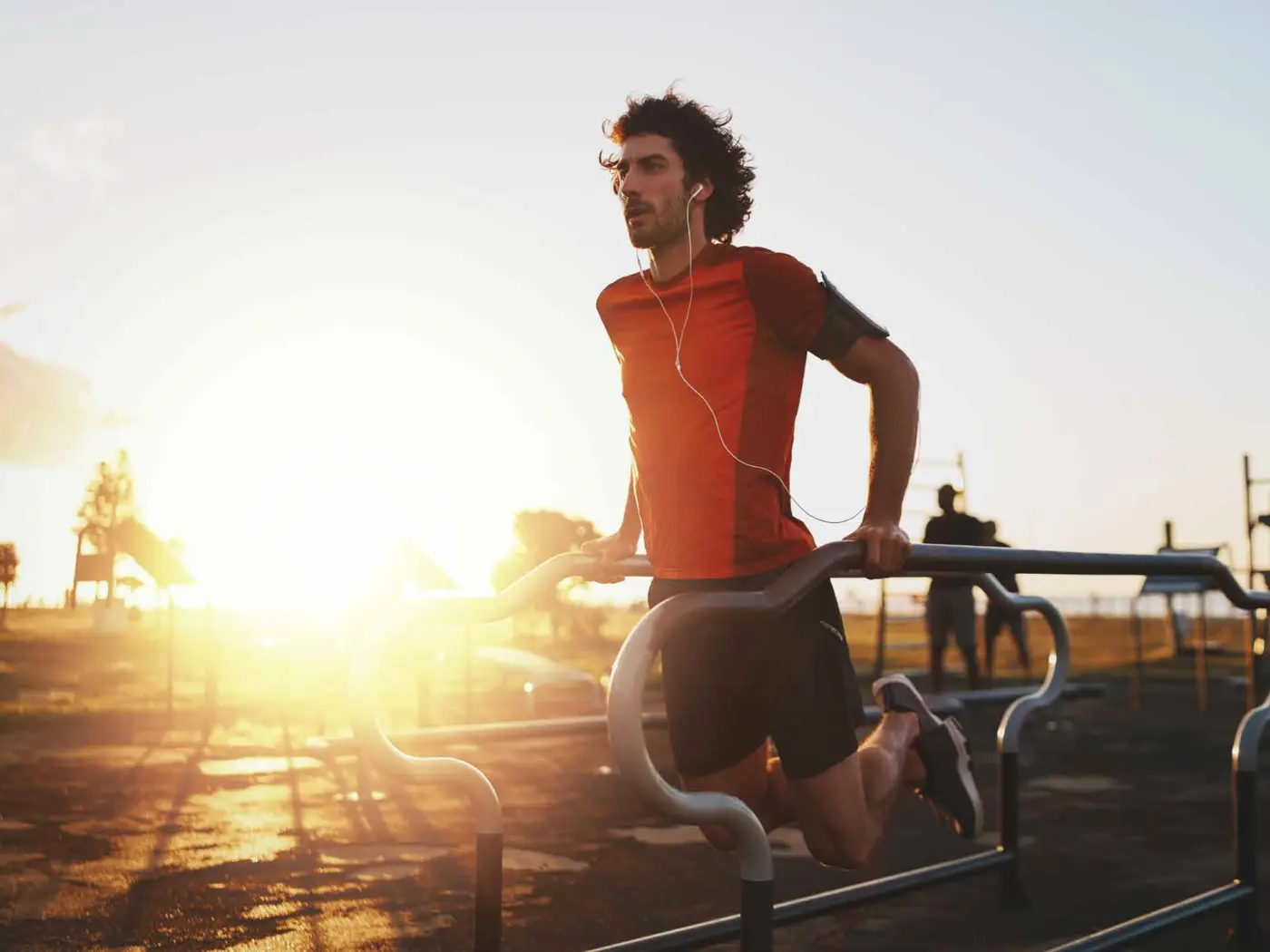 Resident jogging on the outdoor track at sunset