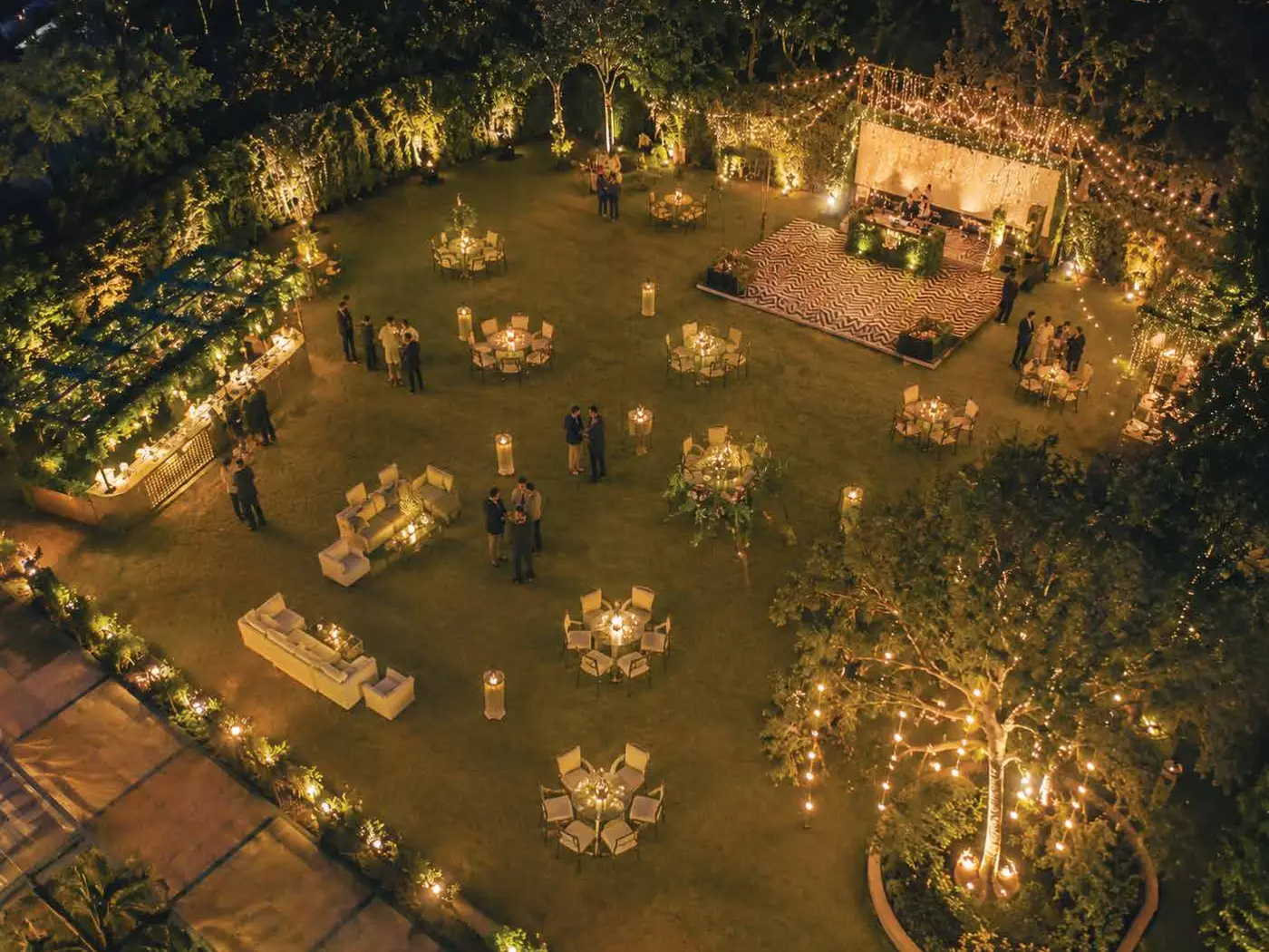 Illuminated party lawn set up for an evening event